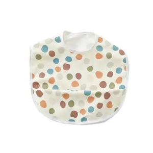 Waterproof baby bib with cute colorful polka dots, lightweight and easy to clean feeding smock.