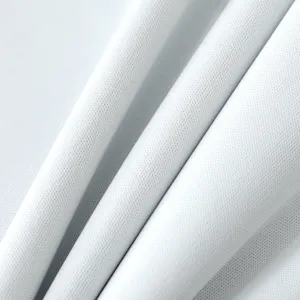 Close-up detail of soft breathable white fabric texture for baby eating bib, clear weave.
