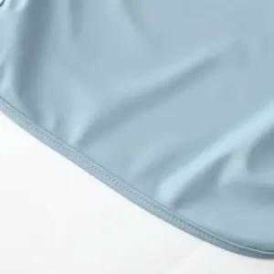 Baby PU waterproof smock detail shot, light blue soft breathable infant feeding bib apron.