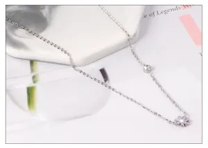 Stainless steel dainty daisy pendant necklace with sparkling stone, elegant floral choker for women.
