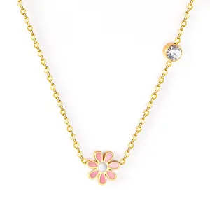Gold-plated stainless steel flower pendant necklace with pink enamel and sparkling stone.