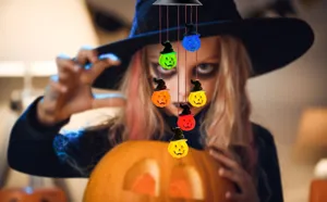 Solar powered Halloween pumpkin wind chime lights with colorful glowing witch hats