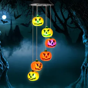 Solar powered pumpkin wind chime with colorful glowing Jack-o'-lantern lights for yard
