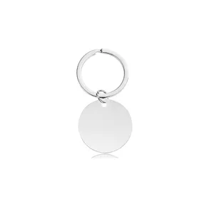 Detailed view of a blank stainless steel round metal keychain tag for custom engraving