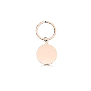 Macro view of a polished rose gold stainless steel blank round keychain tag for engraving