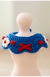 Handmade knitted cat dog collar cute pet bib with red bow and flower accessories detail view.