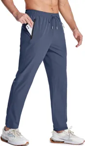 Detail view of men's lightweight breathable athletic pants in blue with secure zippered pockets.
