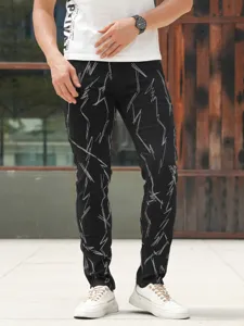 Men's slim fit stretch black denim jeans featuring detailed white embroidery and washed finish.