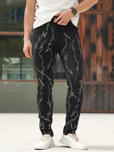 Men's black slim fit stretch distressed jeans with detailed white lightning embroidery style.
