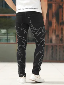 Men black slim fit stretch denim jeans with stylish white abstract embroidery details casual