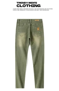 Back detail of green men's slim fit jeans, showing pockets, stitching and leather label.