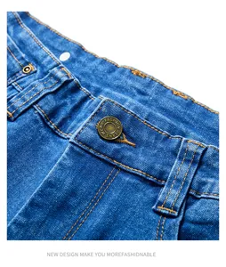 Men's blue denim jeans detail shot showcasing classic metal buttons and orange stitching.