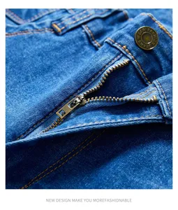 Men's blue denim jeans detail shot showcasing premium fabric, durable zipper and metal button.