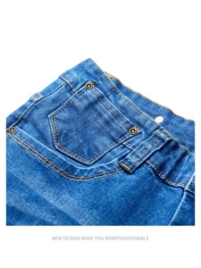 Men's blue denim jeans detail shot featuring coin pocket, contrast stitching, and metal rivets.