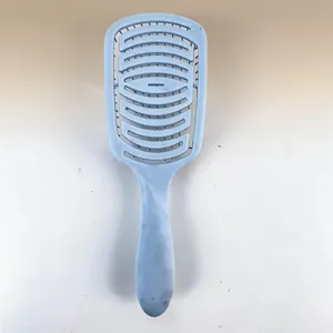Curved vent hair brush for fast blow drying, ergonomic detangling comb for daily hair styling.