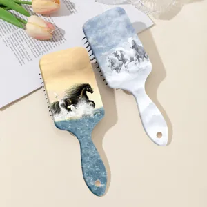 Detailed view of hair massage cushion comb with running horse print pattern for smooth hair care.