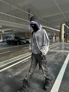 Streetwear distressed flare jeans men, casual vintage grey denim trousers style.