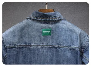 Men retro denim shirt back detail view, classic washed blue fabric, green brand patch