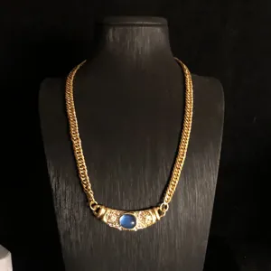 French vintage gold plated chain necklace with blue stone and sparkling crystal charms.