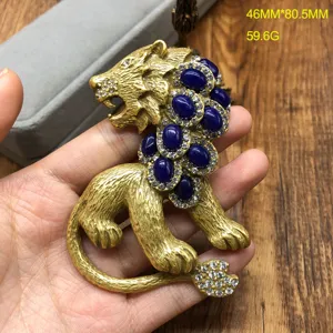 Retro vintage style gold lion brooch featuring blue cabochons and sparkling rhinestones 46x80.5mm