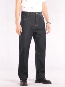 Men's plus size high waist dark denim jeans, loose straight fit casual trousers detail view.