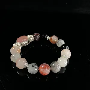 Exquisite crystal beaded bracelet detail showing colorful mineral stones and fine metal accents.