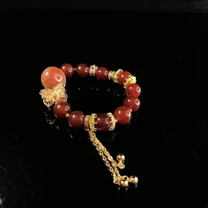 Elegant red agate crystal gemstone beaded bracelet with luxury copper butterfly pendant charm.