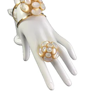 Gold-tone mother of pearl camellia flower bracelet and ring jewelry set for women elegant.