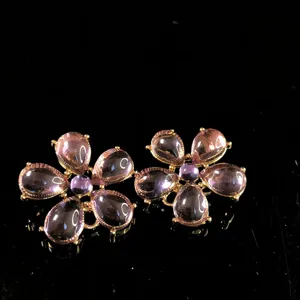 Vintage floral stud earrings with pink teardrop stones and gold-tone setting for women.