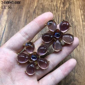 Close-up view of the exquisite purple resin flower jewelry pendant showing intricate details.