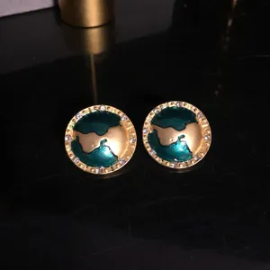 Elegant round globe design earrings featuring green enamel and sparkling crystal rhinestones.