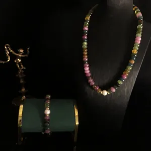 Detail shot of natural colorful tourmaline gemstone beaded necklace and bracelet set.
