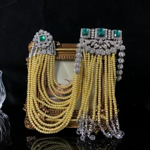 Exquisite vintage multi-strand pearl rhinestone emerald crystal epaulet brooch detail shot.