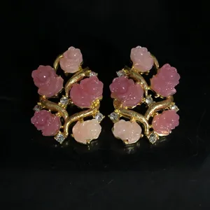 Exquisite 3D pink rose flower earrings with gold branches and sparkling rhinestones. Detail view.
