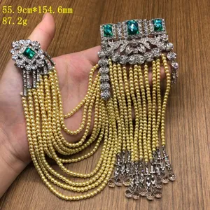 Vintage multi-strand pearl tassel brooch with emerald green crystal rhinestones for shoulder.