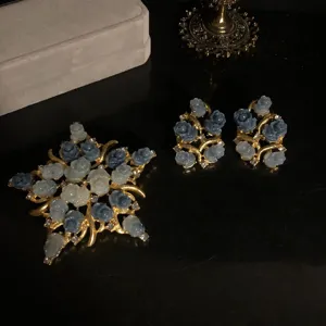Vintage blue carved rose brooch and earrings set, elegant gold-tone flower jewelry for women.