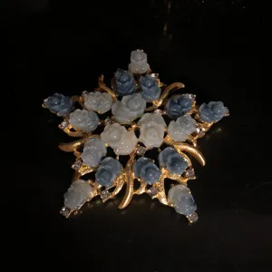 Vintage floral star brooch with white and blue carved roses, gold-tone metallic finish.