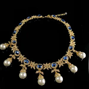 Vintage blue sapphire crystal pearl tassel necklace, elegant gold-tone statement jewelry.