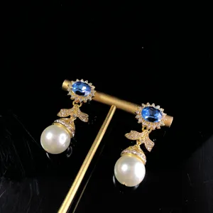 Vintage blue crystal rhinestone pearl drop earrings elegant gold tone jewelry detail view