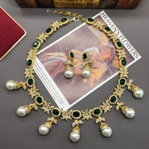 Exquisite vintage green stone pearl necklace earrings set, elegant floral design detail.