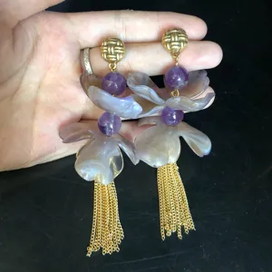Long 3D flower tassel drop earrings with purple beads and gold chain for women details.