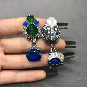 Exquisite vintage baroque clip earrings with colorful rhinestones and blue drop stones.