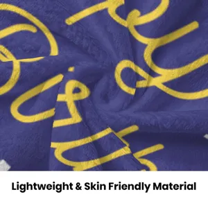 Soft flannel kids blanket detail, cozy purple throw with yellow print for nap and bed time.