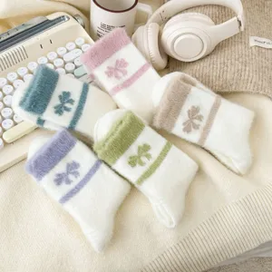 Cozy plush fuzzy winter socks for women, thick warm home floor socks with sweet floral pattern.