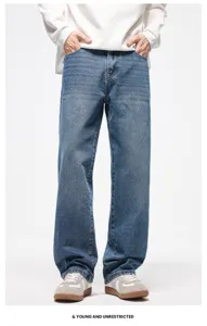 Vista dettagliata dei jeans baggy vintage blu, pantaloni casual dritti e lavati da uomo.