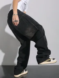 Men's baggy black denim jeans, high street streetwear style, loose wide leg casual trousers.