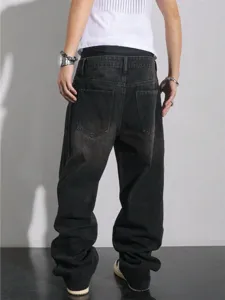 Back view detail of loose black denim jeans, showcasing wide leg fit and back pocket design.