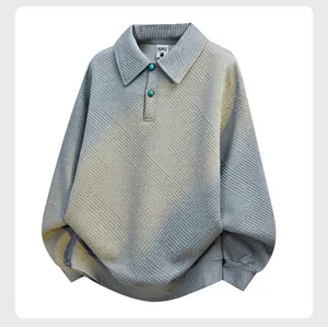 Detailed view of the grey textured long sleeve polo sweatshirt with gradient wash effect and buttons.