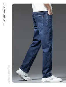 Men's slim fit straight stretch cropped denim jeans in dark blue, back pocket detail view.