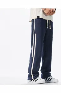 Detail view of men's casual loose straight-leg sweatpants with side stripes and drawstring.